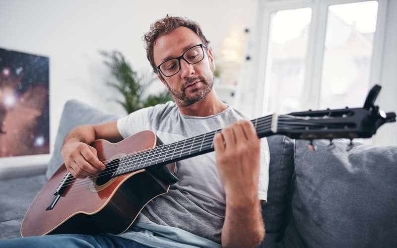 Man Plays a Guitar